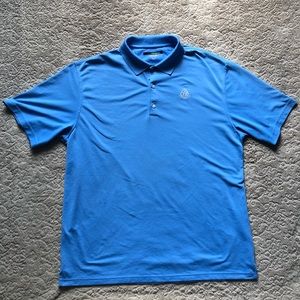 Greg Norman Carolina blue golf shirt